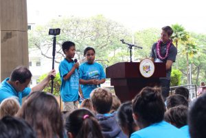 IPA 5th graders, Laʻiku Layaoen and Amelie Kitakis, speak about the importance of renewable energy at the Clean Energy Day rally at the Hawaiʻi State Capitol.