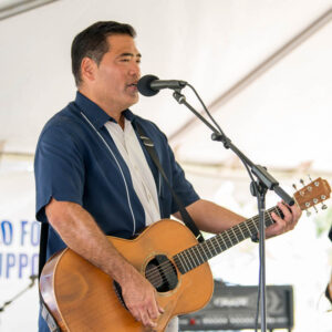 Ellsworth Simeona playing guitar.
