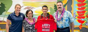 IPA senior Frank Condello III shows his Abbey shirt at letter of intent signing ceremony.
