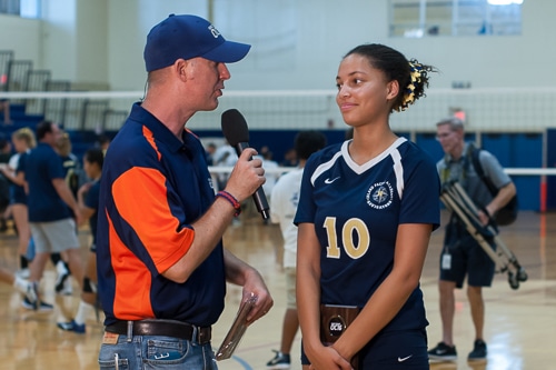 Student volleyball player being interviewed on TV