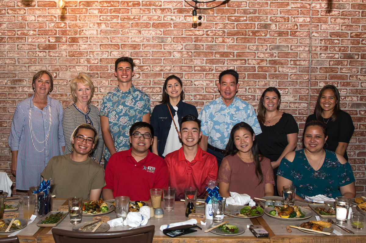 Group photo of alumni at restaurant social