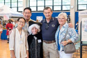 Head of School and founding headmaster with two students