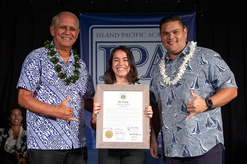 Haley Nakamura receives the Navigator Award from Senator Mike Gabbard