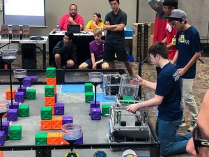 Navigator Robotics team members prep their robot