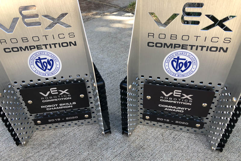 Two VEX robotics award trophies.