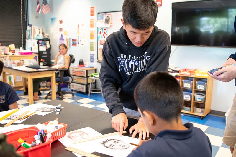 Students collaborate on a math problem.