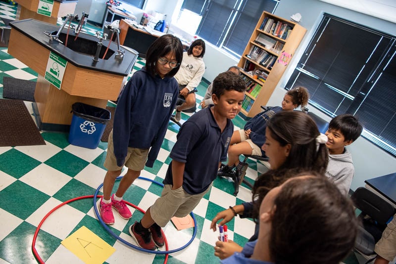 Students collaborate on a math problem.