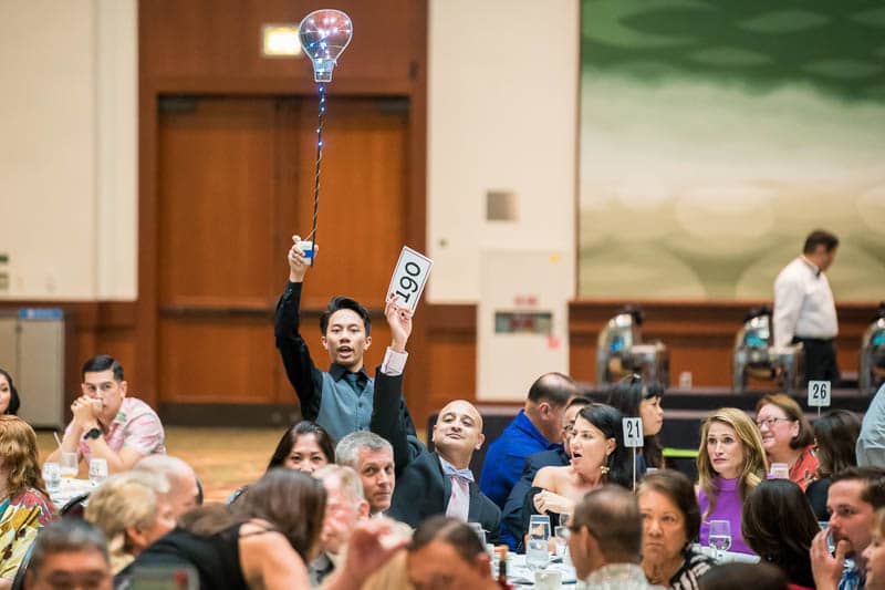 Guests bid during live auction