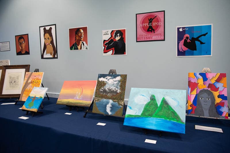 Student artwork displayed on table