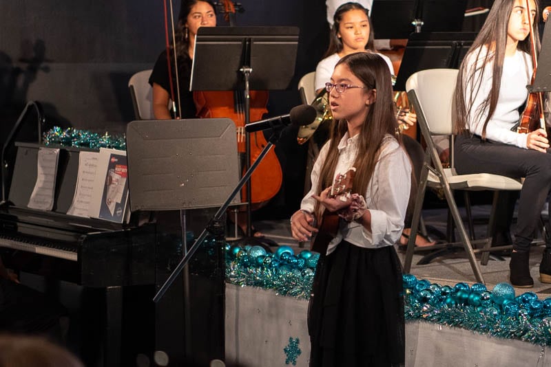 Student performs solo at music concert