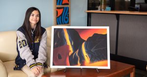 Lina Finley with her artwork