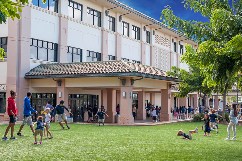 Front of school with children playing