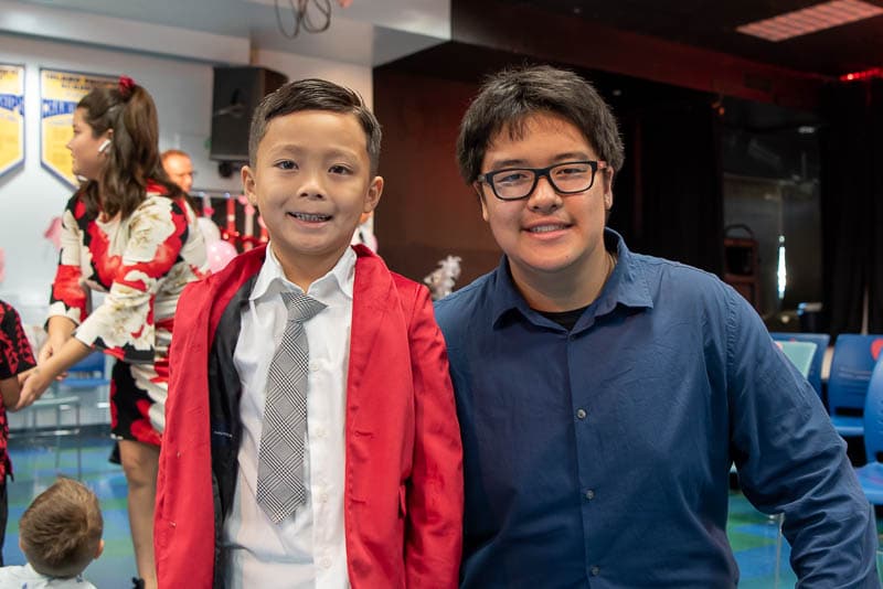 Senior student with kindergartener at Valentine's dance