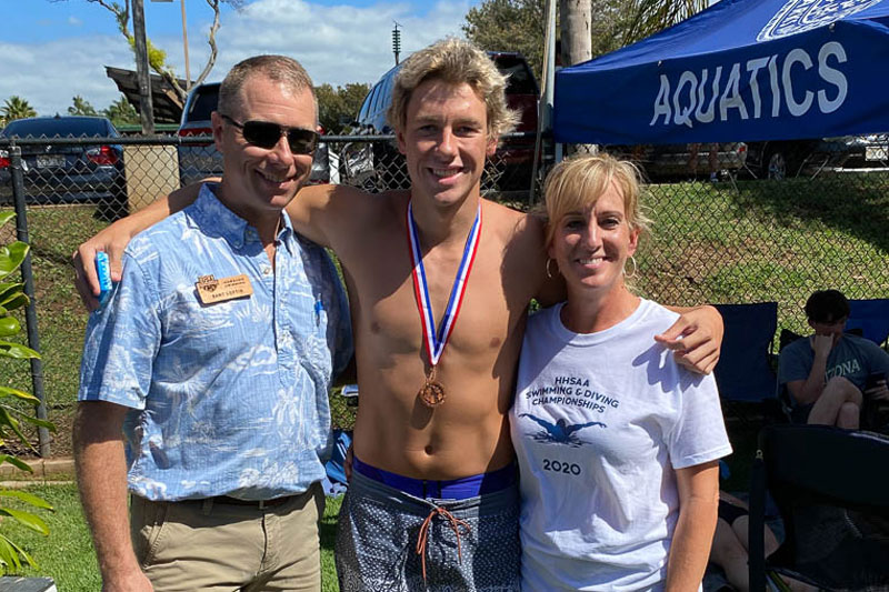Swimmer with his parents