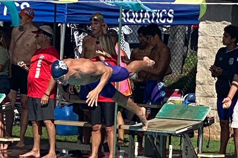 Swimmer diving off the block