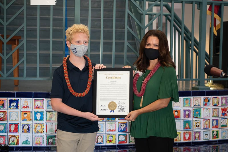 Student receives proclamation from Councilmember Kym Pine