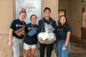 Students deliver gift basket to police department