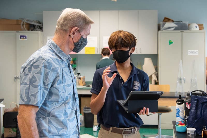 Teacher talking to student