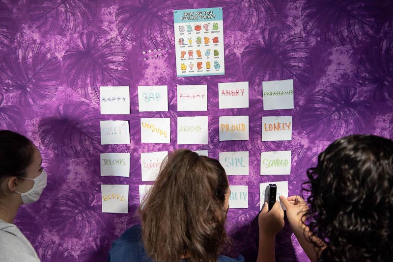 Students around a bulletin board