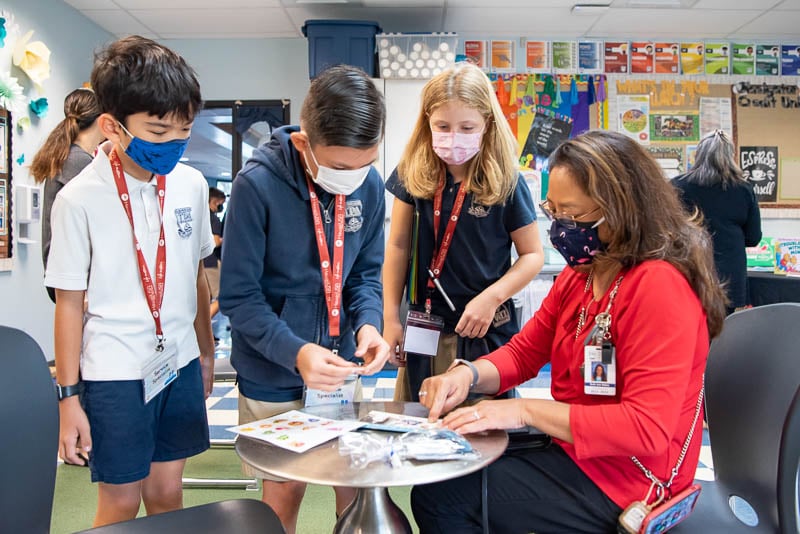 Students assisting credit union member