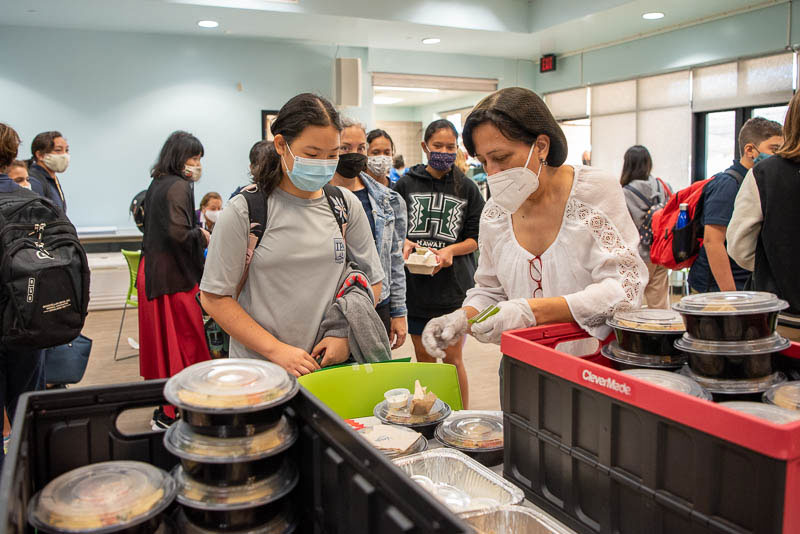 Teacher serving food