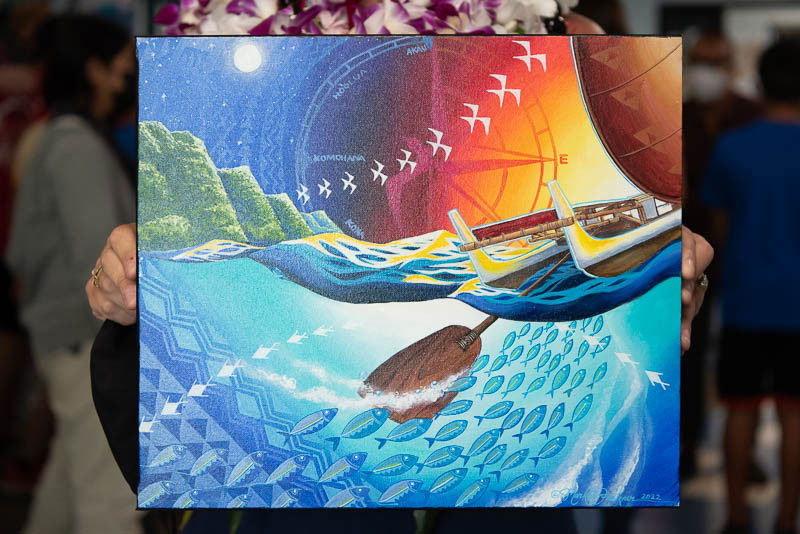 Painting of canoe with sea birds and fish.