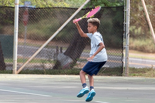 Young IPA student playing tennis