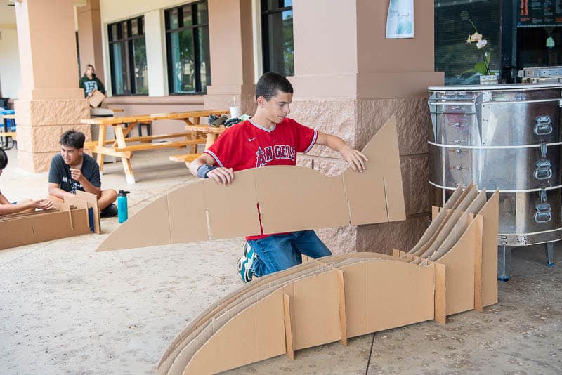 Student constructing his cardboard chair.