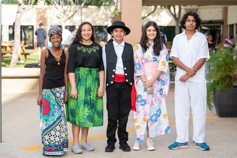 Students dressed in traditional ethnic clothing.