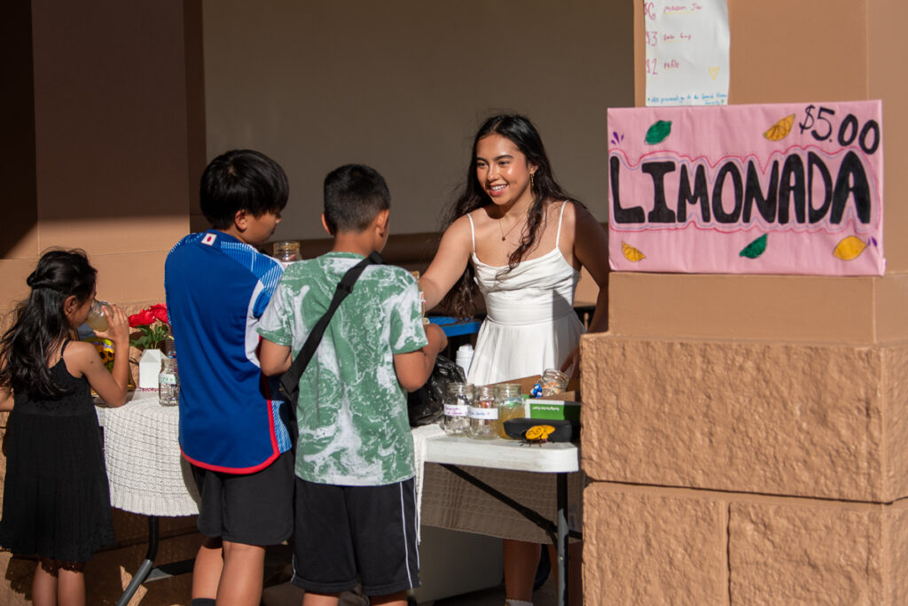 An Island Pacific Academy Spanish language student sells lemonade.
