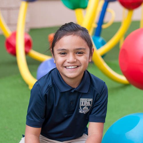 Grade 3 student smiling in playground